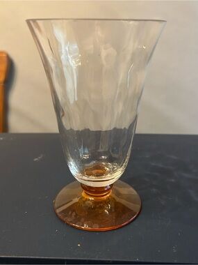 Vintage Fostoria footed tumbler featuring an iridescent amber base.